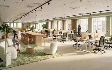 Öppet kontorslandskap med loungedel (visionsbild)